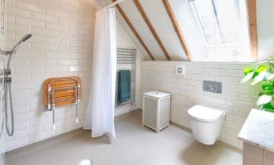 Photo of accessible wet room ideas sensitively designed and installed in a beautiful barn conversion
