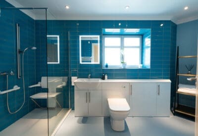 New accessible bathroom with level access shower incorporating a folding shower chair