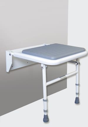 Wall-mounted folding shower stool with grey padded seat and adjustable support legs, designed for stability, comfort, and easy storage in the shower.