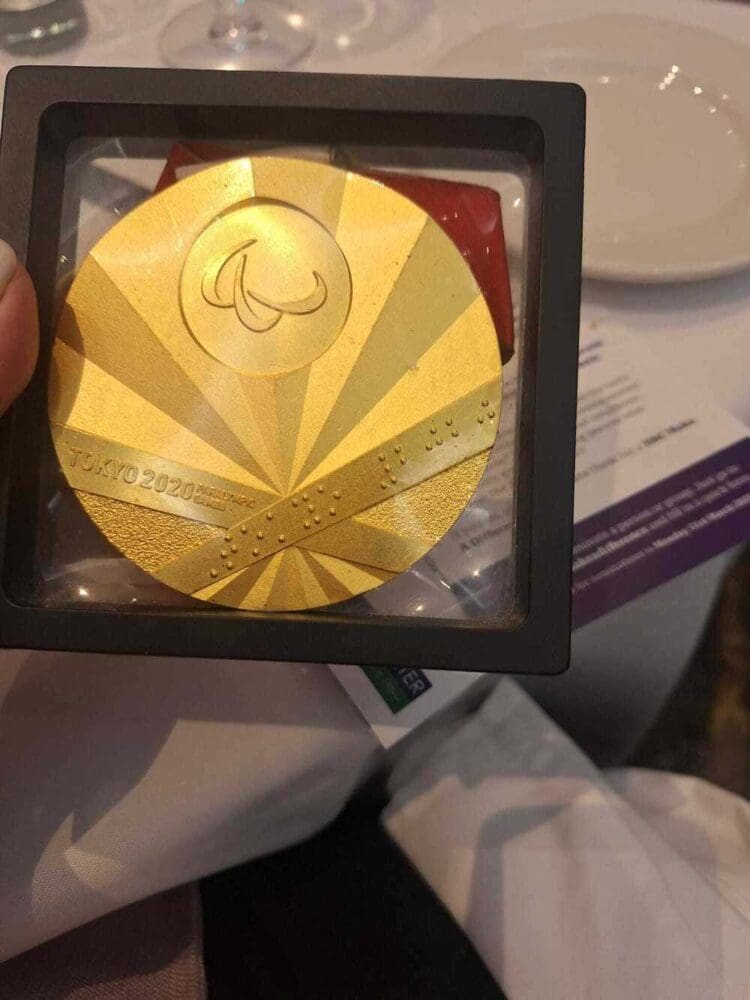 Hand holding an award at the HCO lunch event