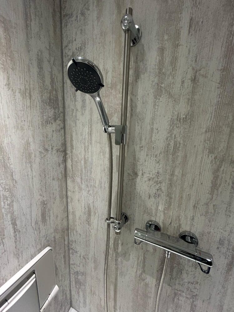 This image shows a Triton Elina Shower With Grab Rail Riser Rail in chrome