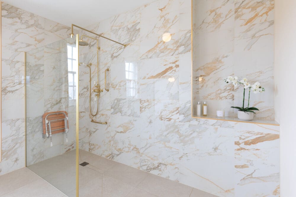 Wet Room with Floor and Wall Tiles, a wooden slatted seat and dual head shower