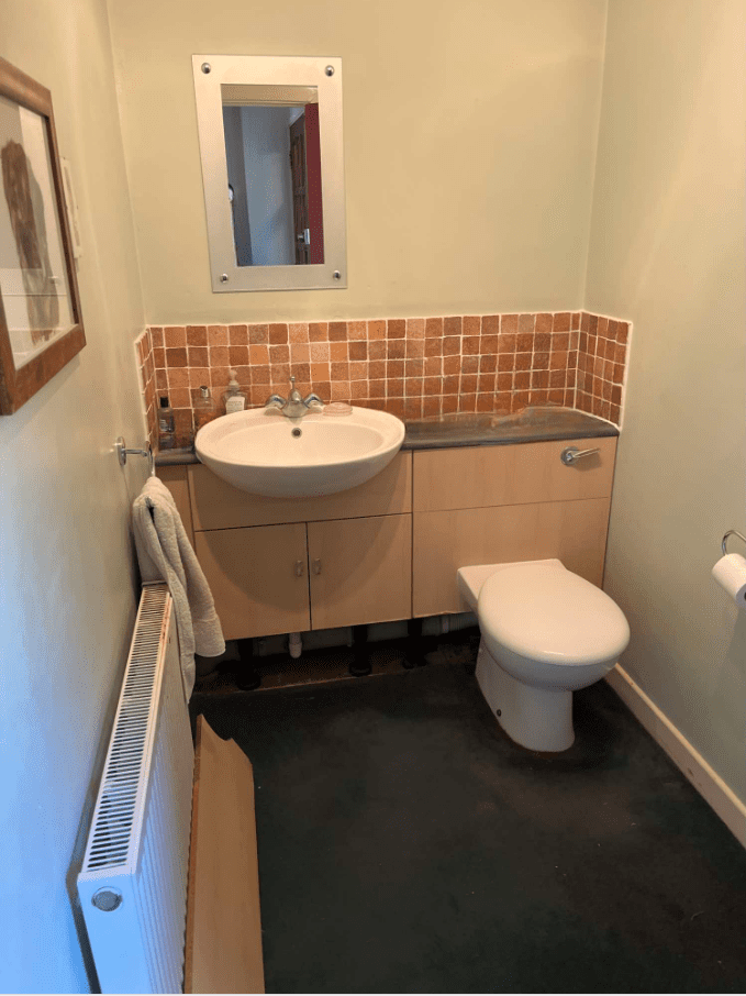 Cloakroom, with fitted basin and toilet