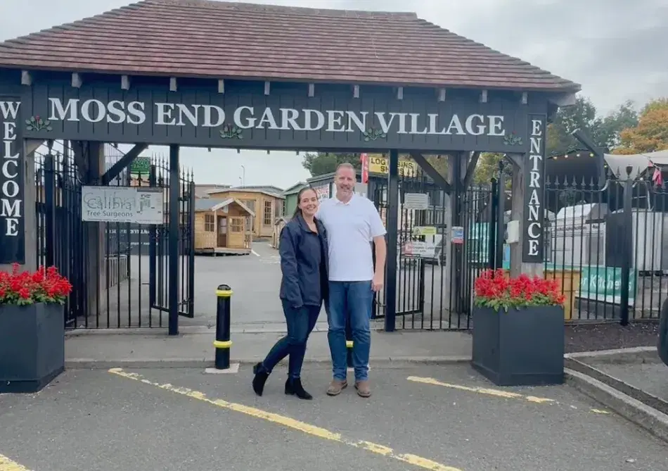 Darren And Rachel Outside Showroom Garden Village